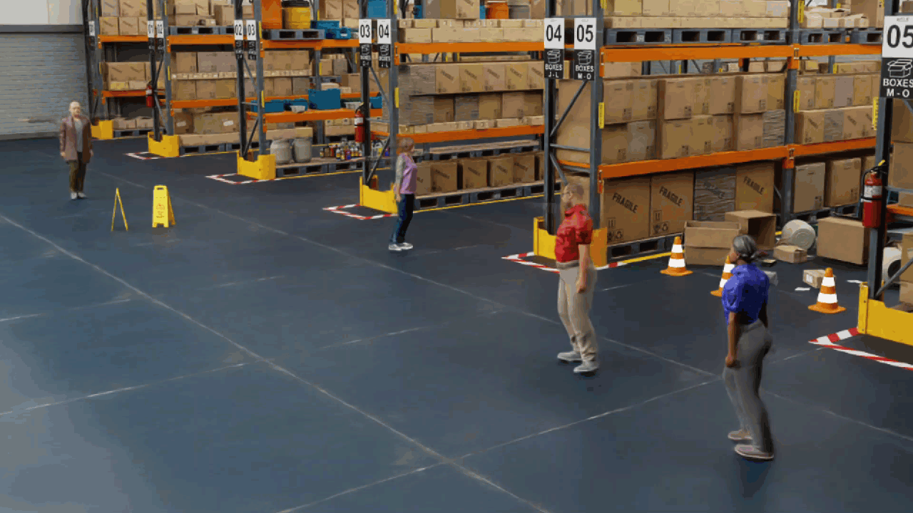 Humans walking around a warehouse environment.